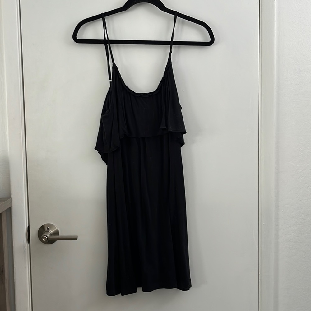 Flounce, black dress with adjustable straps.